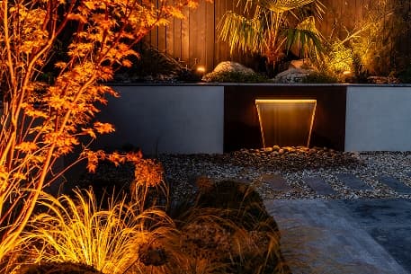 Garden illuminated with architectural outdoor lighting