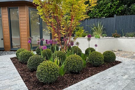Layered planting scheme with seasonal texture