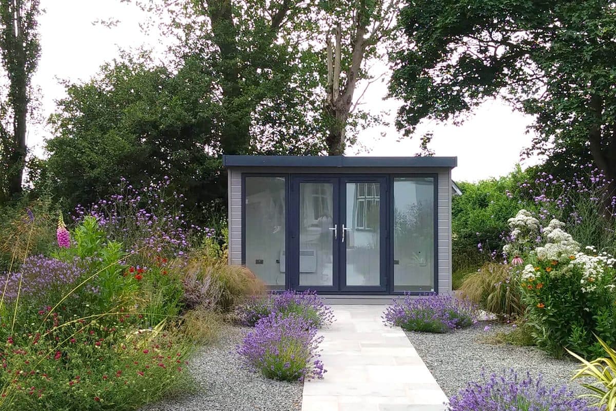 Timber garden studio positioned with boundary clearance